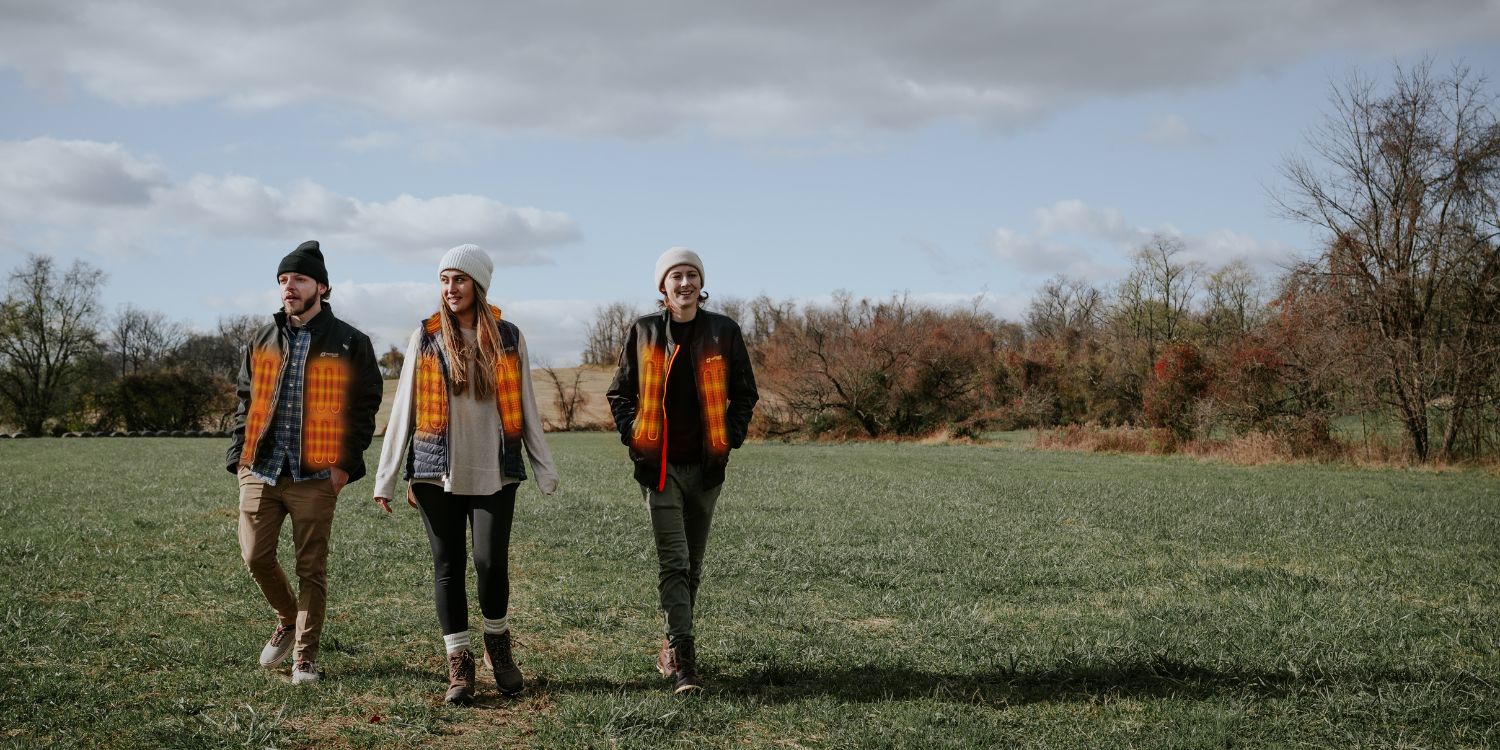 Three models wearing heated apparel outdoors