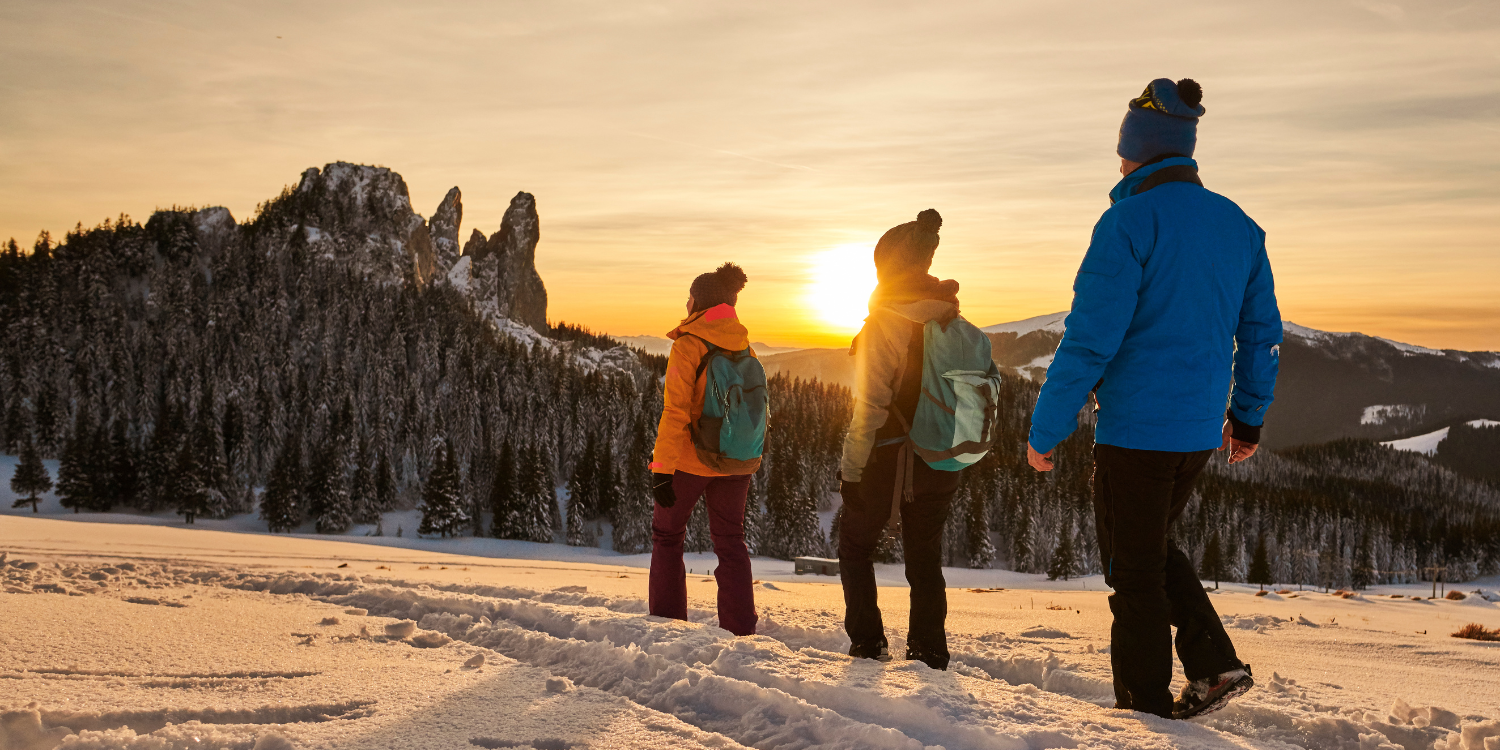 Three people hiking in the winter